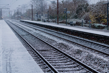 Fototapeta premium Railway. A train approaches the station on a winter day.