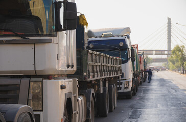 A line of trucks stuck on a highway, traffic, mobility problem