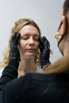 Beautician Preparing Client for Microblading Treatment