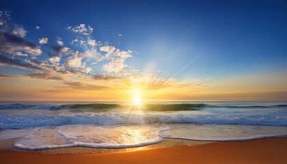 colorful ocean beach sunrise with deep blue sky and sun rays