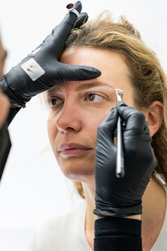 Professional microblading procedure by skilled beautician