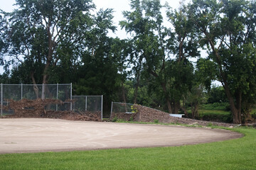 Collapsed Chain Link Baseball Fence With a Baseball Diamond