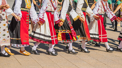Bulgarian Folk Dancers Perform Traditional Horo in a City Setting