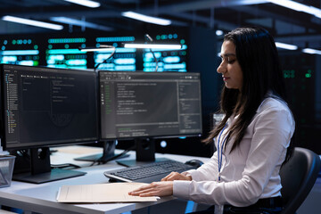 Data center manager checking emergency procedures documents to ensure company continuity in case of system failure. Inspector in high tech server hub ensuring compliance with industry regulations