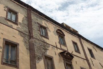 Weathered Historic Building Facade with Exposed Stone