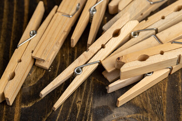 a group of wooden clothespins for drying clothes
