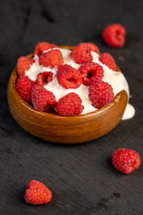 delicious and fresh yogurt with raspberry flavor and whole red raspberries