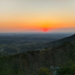 sunset in mountains with red horizon 