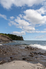 A beautiful view of Split Rock Lighthouse on the rocky coast of Lake Superior.