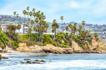 Laguna Beach ocean shoreline with palm trees at Treasure Island Park, Orange County, California USA