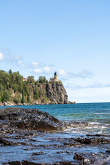 A beautiful view of Split Rock Lighthouse on the rocky coast of Lake Superior.