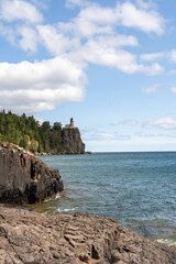A beautiful view of Split Rock Lighthouse on the rocky coast of Lake Superior.
