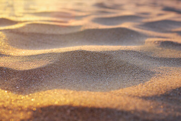 Golden waves of sand on the seashore