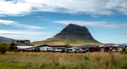 Modern homes with mountain backdrop and blue sky