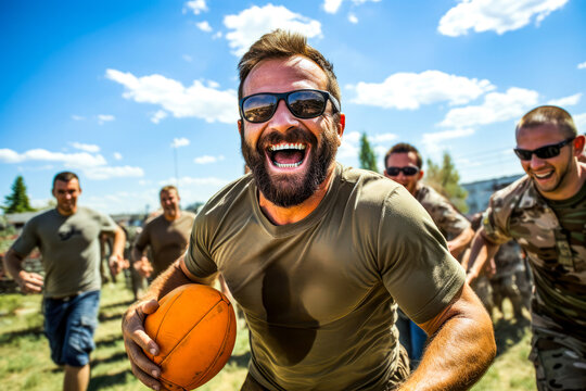 Caucasian white military man enjoying rugby game with team on bright day. Concept of social integration, sport activity adaptive programs, rehabilitation for veterans. Reintegration and mental health
