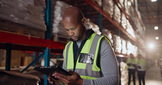 Logistics, black man and tablet in warehouse for order, checklist and inventory management. Male worker, digital technology and factory in shipping company for export, distribution and supply chain