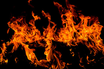 Fire flames on black background. Fire sparks background. Abstract dark fire flames background....