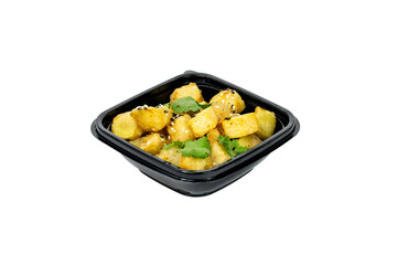 Warm roasted root vegetables garnished with fresh herbs and sesame seeds