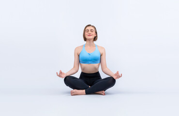 Fototapeta premium Full body length gaiety shot athletic and sporty woman doing healthy and meditative yoga exercise workout posture on isolated background. Healthy active and body care lifestyle