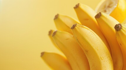 Fresh bananas in bunch with yellow background