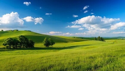 Fototapeta premium summer landscape in a hilly region sunny day outdoors with clouds and clear blue sky