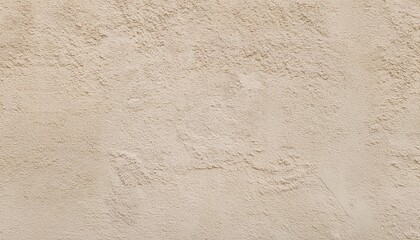 light beige rough grainy stone or plastered wall texture background