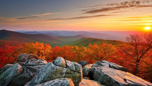 sunset view from grayobbled rock in the shenandoah national park overlooking valley with colorful trees and distant mountains