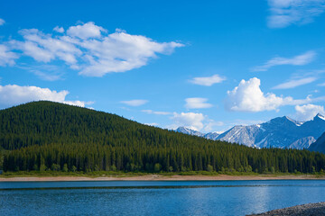 An incredible view of a natural mountain lake on a sunny summer day against the backdrop of the...