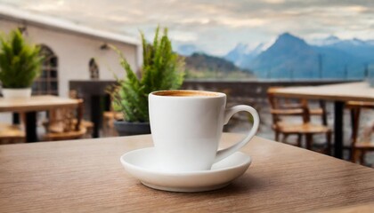 Fototapeta premium White coffee cup mockup on restaurant table