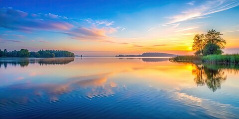 Obraz premium Tranquil dawn over a peaceful lake with soft colors and gentle waves , tranquil, dawn, peaceful, lake, sky, gentle, waves