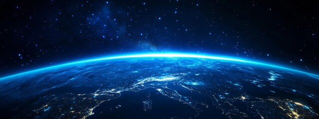 Obraz premium Stunning night sky view from space showing planet Earth with glowing European region. The sky is filled with stars, and Earth is illuminated in blue hues against the backdrop of space.