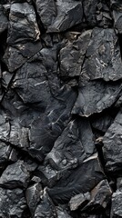 Deep black stone texture ideal for graphic design backgrounds and creative projects