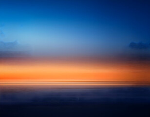 Fototapeta premium a visually striking dark blue and orange gradient abstract background banner with a subtle blur, suitable for contemporary digital art pieces