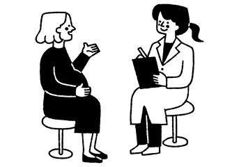 A woman talking to a female doctor during a pregnancy checkup_2