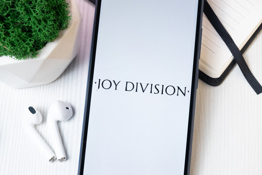 New York, USA - 1 August 2024: Joy Division Logo on Phone Screen, Music Icon on Display
