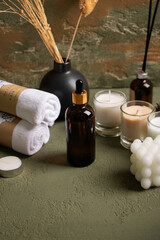 Amber Dropper Bottles with Spa Essentials and Candles on Rustic Background for Natural Skincare Mockup