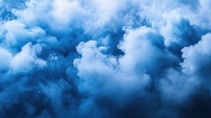 Fototapeta premium Dramatic blue cloud texture capturing the essence of a misty, mysterious atmosphere. Perfect for backgrounds or atmospheric concepts.