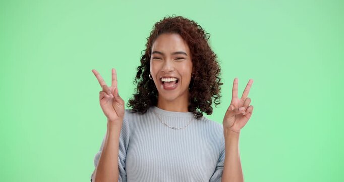 Green screen, hands and face of woman with peace sign, emoji and reaction for message with laugh. Female person, portrait and v symbol for gesture of goodwill, goofy and pout by chromakey with pride