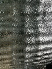 Aluminum foil reflects sunlight, shiny and glossy. Use it as a background to put text.	