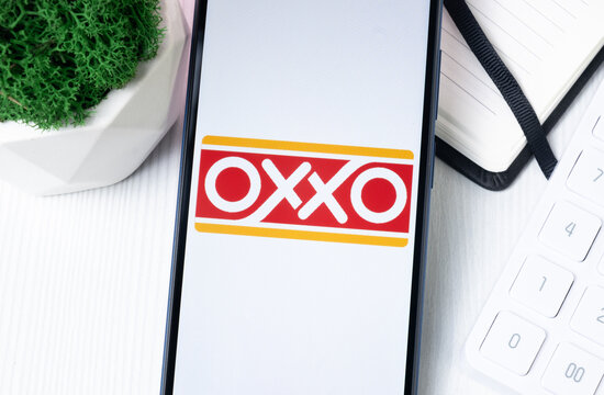 New York, USA - 1 August 2024: OXXO Logo on Phone Screen, Company Icon on Display