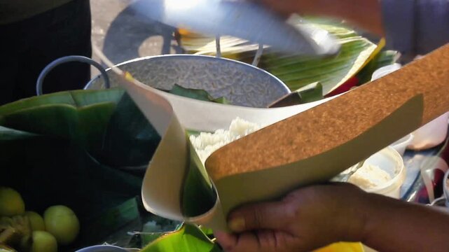 The buyer is making an order of liwet rice for a customer