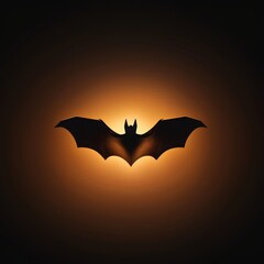 Fototapeta premium Silhouette of a bat illuminated by a warm, glowing light background, depicting a mysterious and moody night scene.