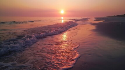 Fototapeta premium Watching the sunrise over the ocean is a magical start to any beach day