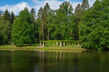 View of the pergola with a pier on the shore of the Chinese Pond in the Oranienbaum Palace and Park...