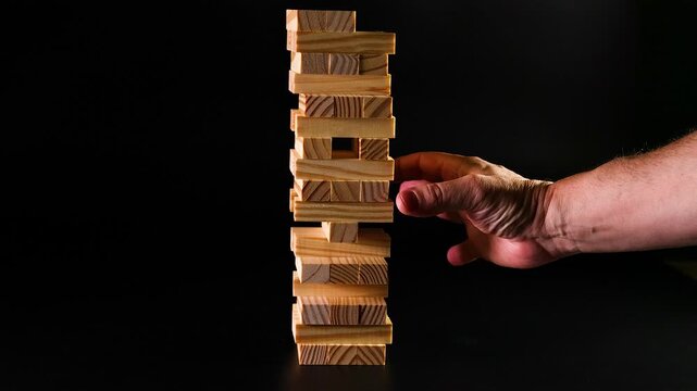 Playing a Wooden Block Tower Game