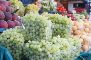 Explore the Fresh and Juicy Green Grapes available at the Vibrant and Bustling Fruit Market