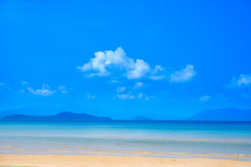 Nature of the beach and sea Summer with sunshine, sandy beaches, clear blue waters sparkling against the blue sky. On an island with good ecology and environment Background for summer vacation concept