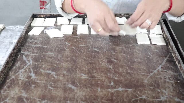 Malegaon, India 17th July 2024: Delicious fresh puff pastries also Khari is a light and fluffy biscuit often served in Indian homes with chai. Food and breakfast. Visuals of Indian bakery.