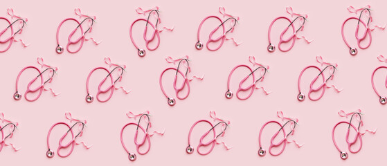 Pink ribbon and stethoscope on color background. Breast cancer awareness concept