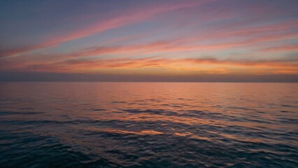 Obraz premium Sunset over a Calm Ocean, 
